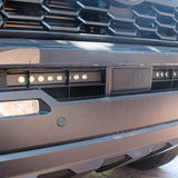 upclose view gray 2024 toyota tacoma led light bar behind grille 