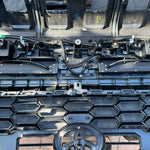 behind grille new 2024 toyota tacoma showing light bars
