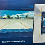 Ford F150 Raptor camera display with parking assist for safety, showing surroundings and overhead view of vehicle.
