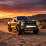 2024+ Ford F150 Raptor with LED light bar driving in the desert at sunset, showcasing Ford F150 Raptor Light Bar.