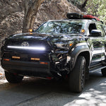 4Runner Ditch lights dual color LED ditch and light bar setup on 2025 Toyota 4Runner parked on forest road