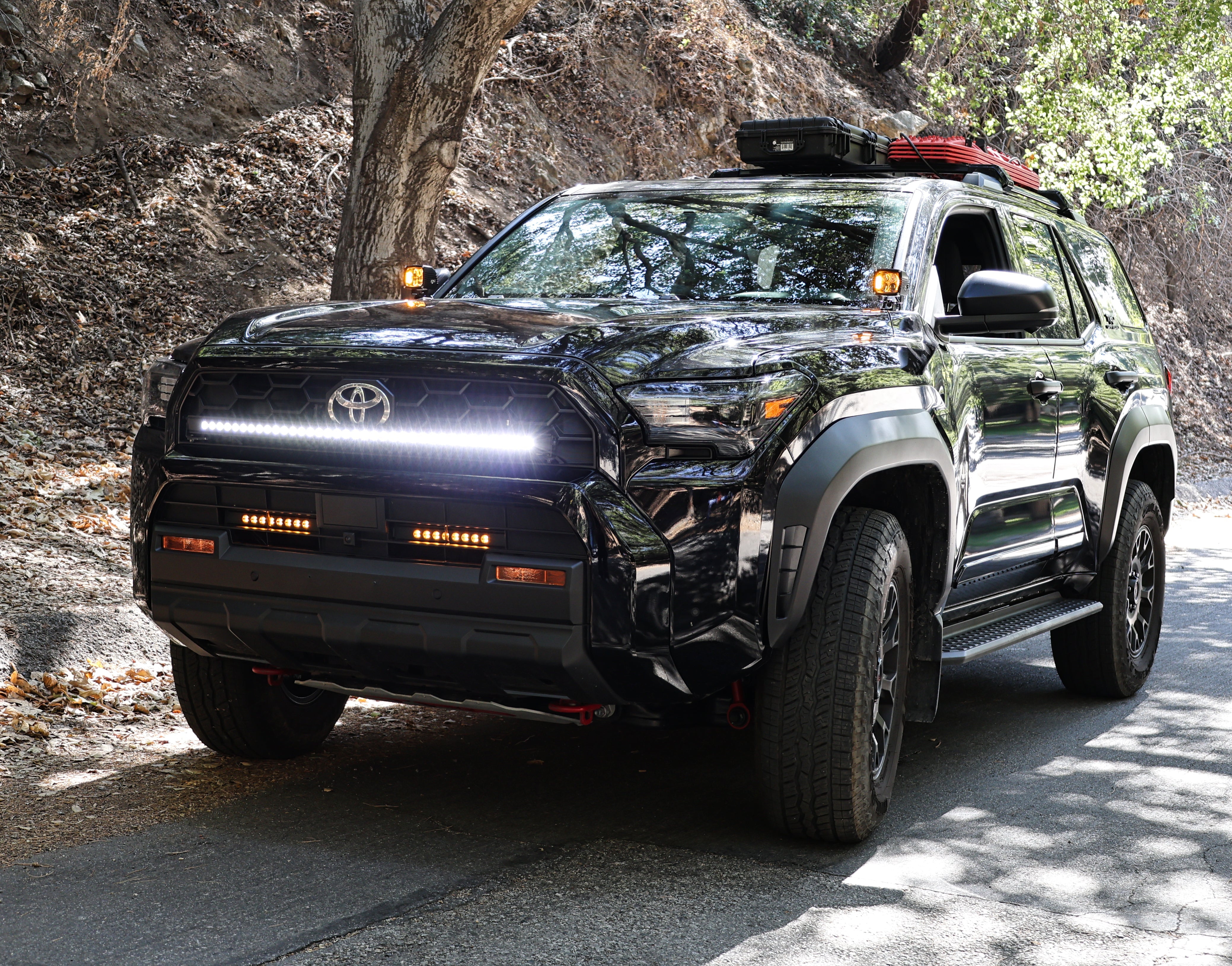 4Runner Ditch lights dual color LED ditch and light bar setup on 2025 Toyota 4Runner parked on forest road