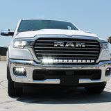 white 2025 ram 1500 with LED light bar on top bumper and fog lights