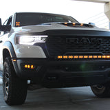 RAM RHO FOG on RAM 1500 RHO 2025+ front view with factory bolt-on fit, black powder-coated brackets, no cutting required (RAM RHO FOG)