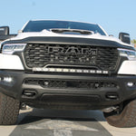 RAM RHO FOG light kit installed on 2025+ RAM 1500 with black powder-coated bracket and factory bolt-on fit