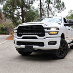 2025+ RAM 2500 light bar 40in PRO curved LED installed on white RAM 2500 truck front view on mountain road