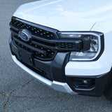 Front view of a white Ford Ranger highlighting the slim grille-mounted LED light bar