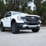 White Ford Ranger in a scenic outdoor setting with the grille-mounted 30-inch PRO LED light bar