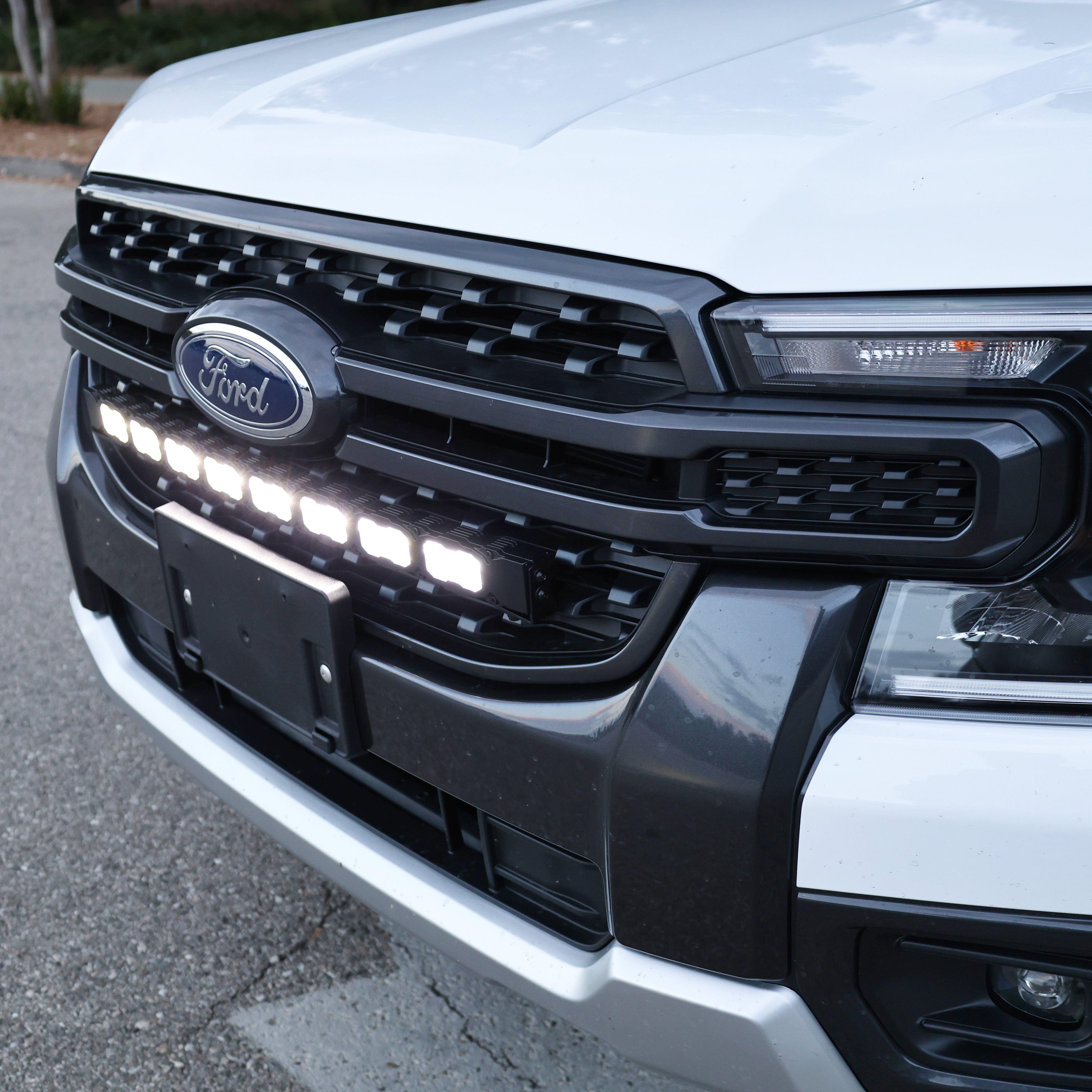 Close-up of the 30-inch PRO LED light bar bolted into a Ford Ranger front grille