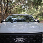Ford Maverick Ditch Lights 2025 dual color ditch light kit installed on front of Ford Maverick truck in wooded road setting