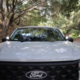 Ford Maverick Ditch Lights 2025 dual color ditch light kit installed on front of Ford Maverick truck in wooded road setting