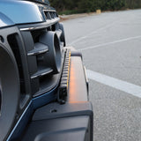 2024+ Ineos Grenadier front three-quarter view with slim 30in light bar across the front bumper