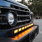 Ineos Grenadier 30in light bar slim black bracket mounted along the top of the front bumper, daylight