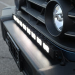 Close-up of the Ineos Grenadier 30in light bar lit in white, TIR LED cubes in black housing
