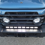 Light-blue 2024+ Ineos Grenadier front corner with 30in bumper light bar and round headlight, daylight