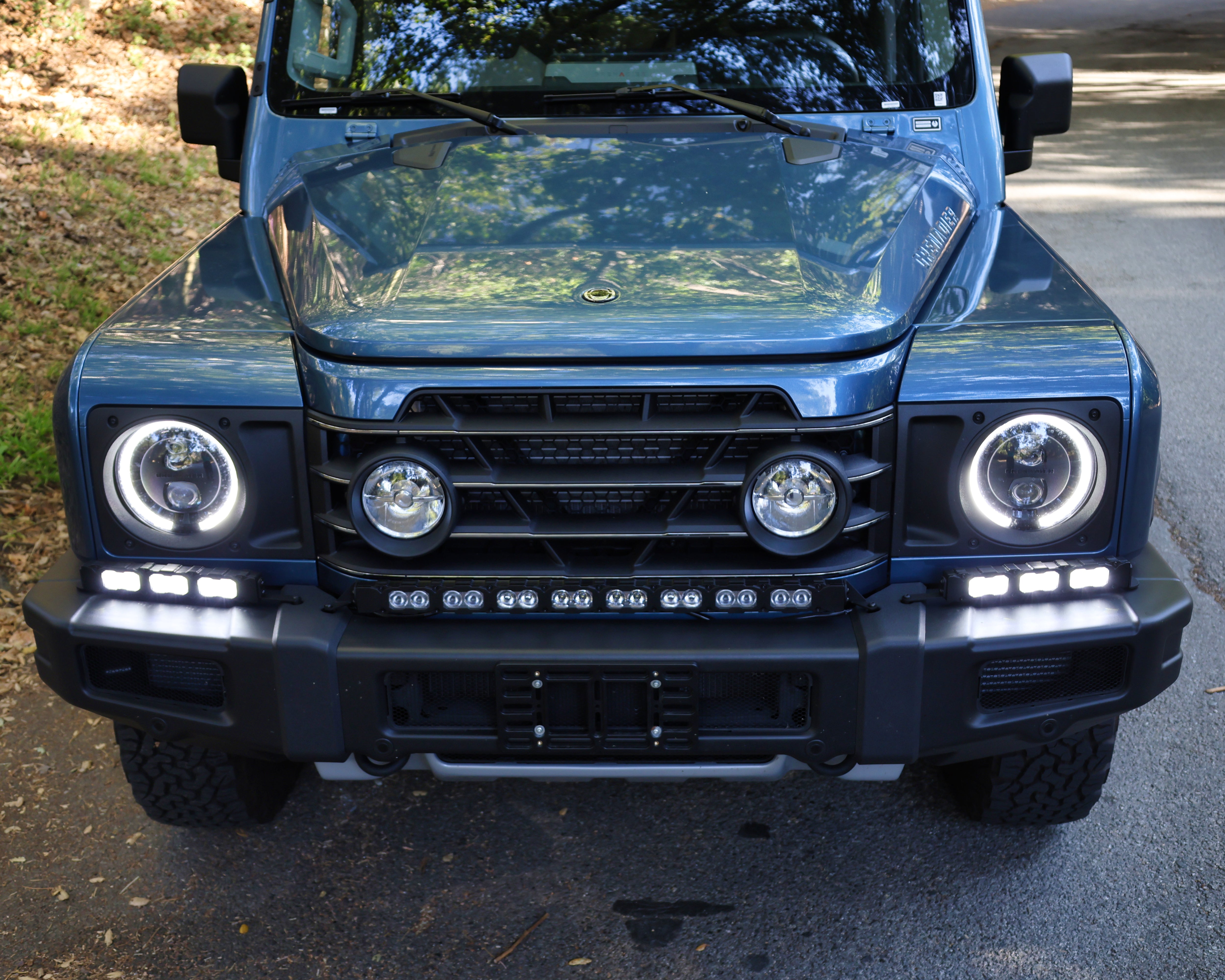 2024+ Ineos Grenadier front view with XL light bar kit mounted and unlit, 30in center bar and two 12in extensions