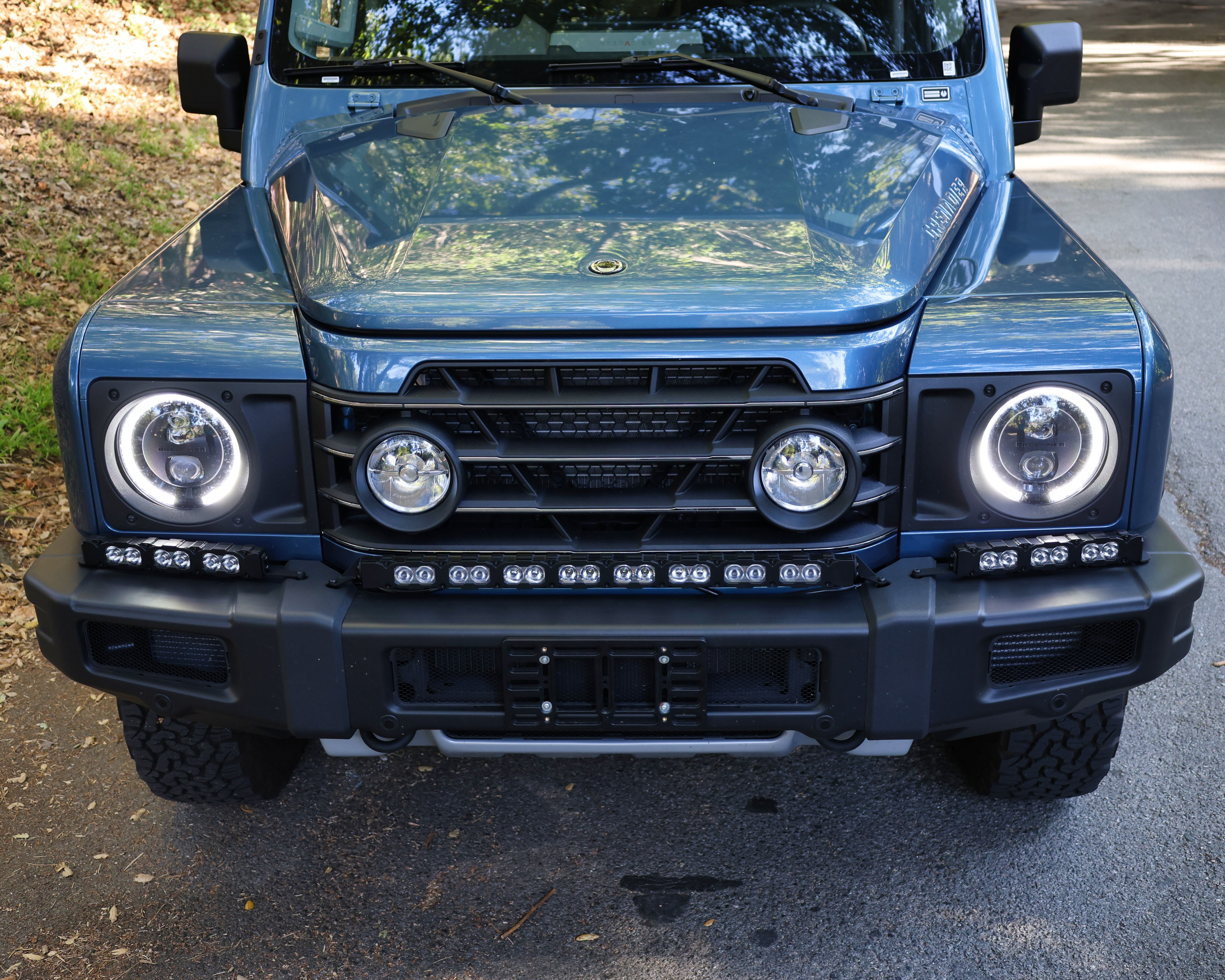 Ineos Grenadier XL 30in-plus-12in light bar kit mounted on the front bumper, unlit daytime front view
