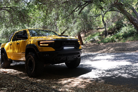 2022 yellow ram trx with m&r automotive off road ditch lights light bar and fog lights for off roading