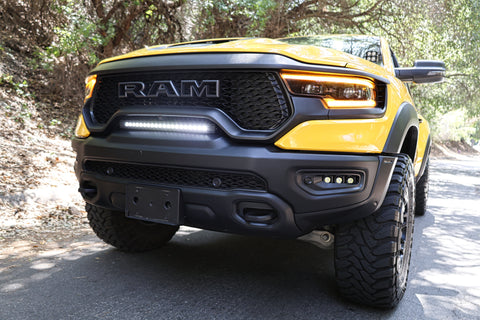 2021 yellow ram trx with m&r automotive off road ditch lights light bar and fog lights for off roading