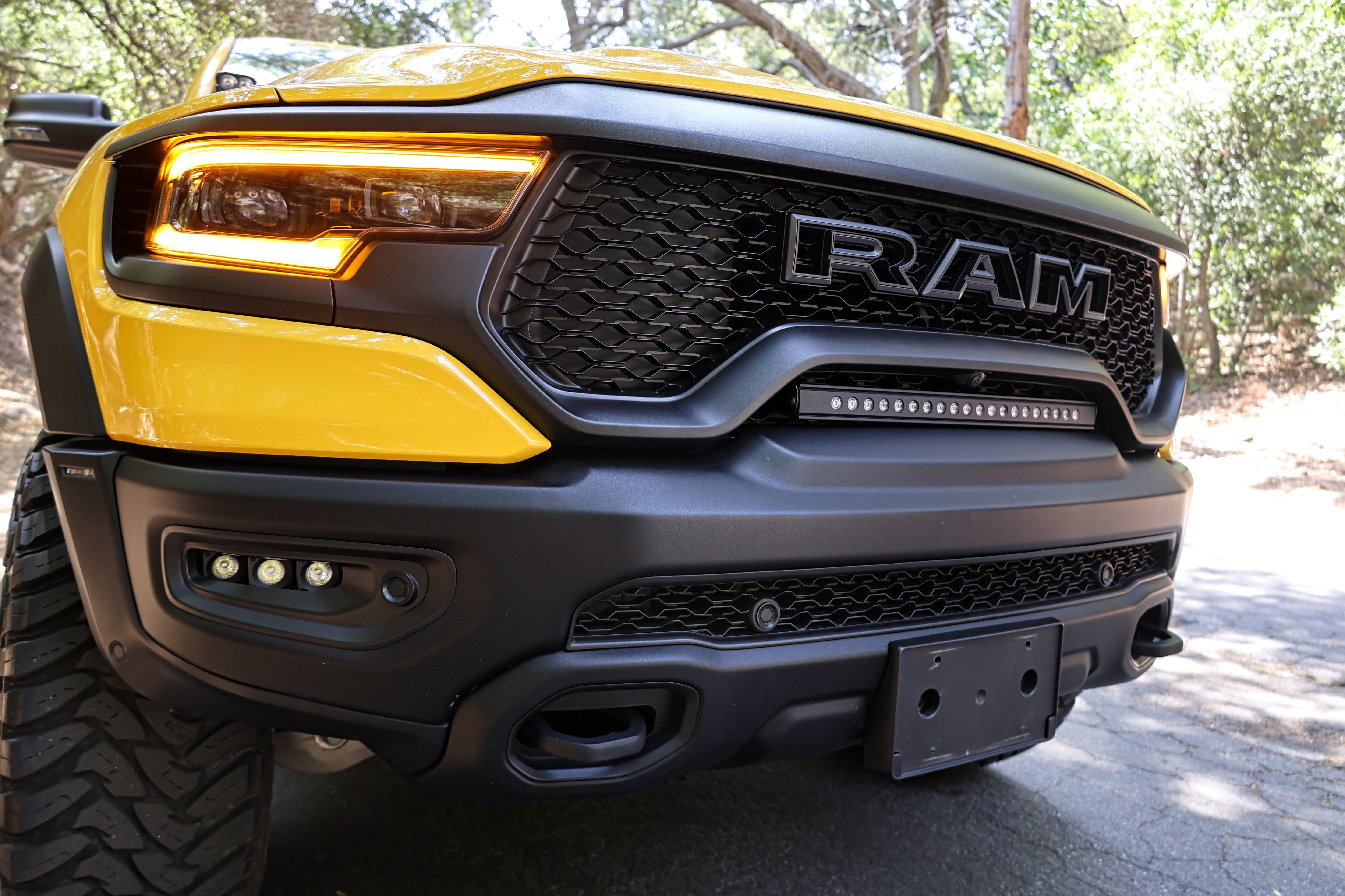RAM TRX Light bar slim 23in curved LED installed in factory grille opening on 2021-2024 RAM 1500 TRX front bumper