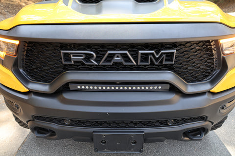 top view of light bar on top of bumper on yellow 2024 ram trx