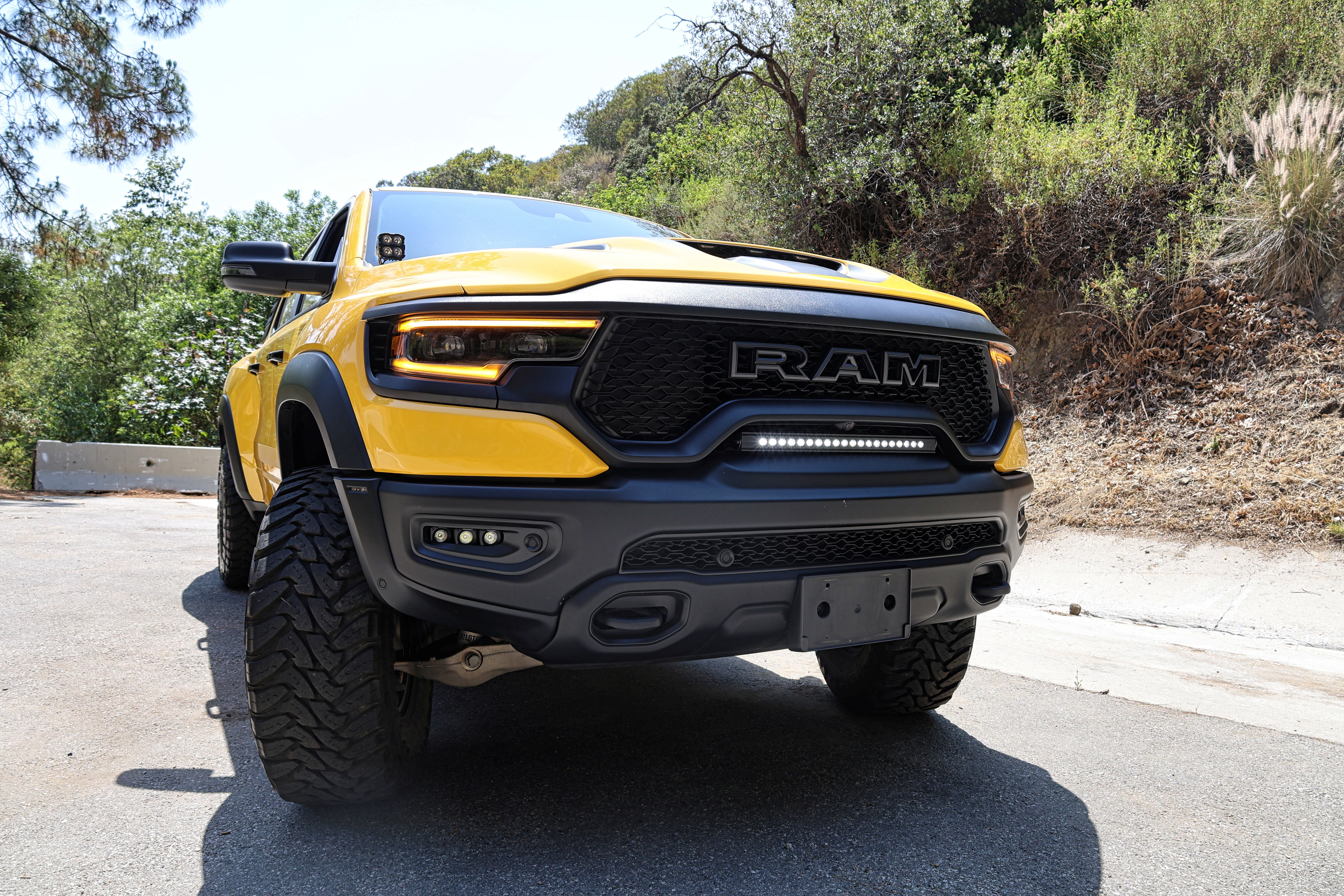 2024 yellow ram trx with m&r automotive off road ditch lights light bar and fog lights