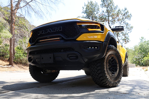 2024 yellow ram trx with m&r automotive off road ditch lights light bar and fog lights for off roading