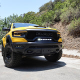 RAM TRX Lightbar 23in PRO installed on yellow RAM 1500 TRX in factory grille opening on forest road