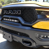 RAM TRX Lightbar 23in PRO mounted between grille and bumper on yellow 2021-2024 RAM 1500 TRX front view