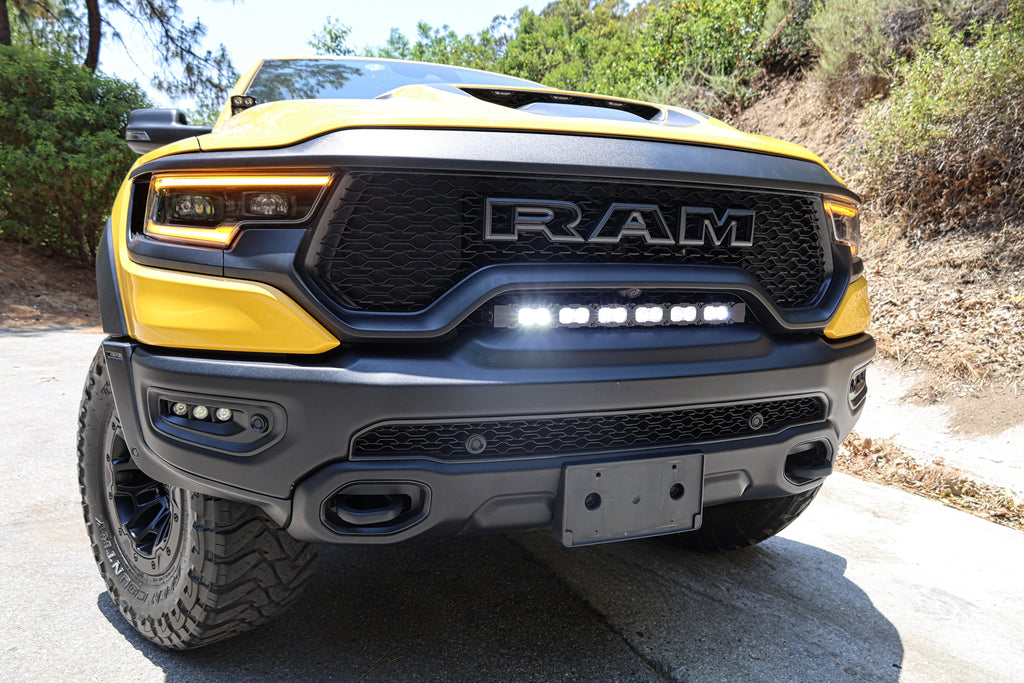 2024 yellow trx upclose grille view with light bar and fogs lights