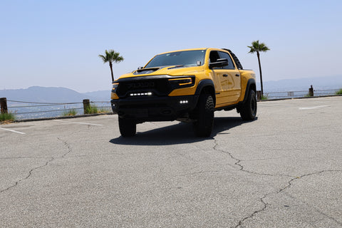 2024 yellow ram trx with m&r automotive off road ditch lights light bar and fog lights for off roading