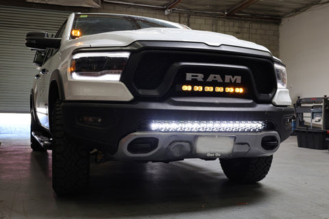 white 2019 ram 1500 rebel with light bar for off roading m&R automotive