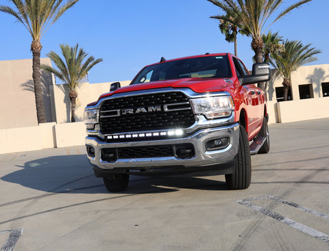 2024 red Ram 2500 HD with LEd light bar on top of bumper for off roading 
