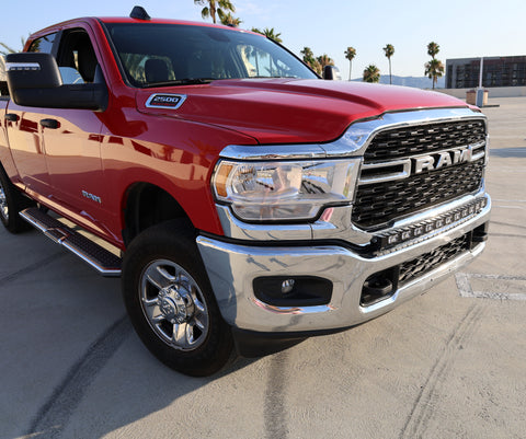 2023 red Ram 2500 HD with LEd light bar on top of bumper for off roading 