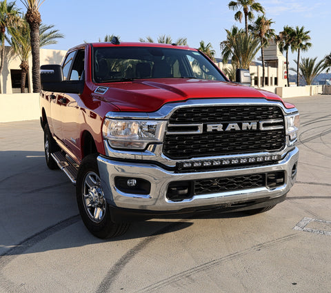 2019 red Ram 2500 HD with LEd light bar on top of bumper for off roading 
