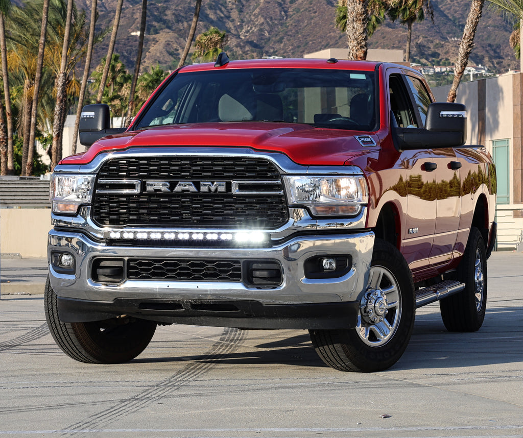 2025 red Ram 2500 HD with LEd light bar on top of bumper for off roading 