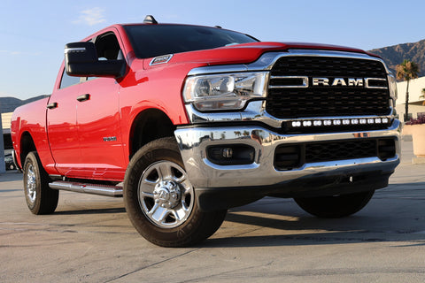 2020 red Ram 2500 HD with LEd light bar on top of bumper for off roading 