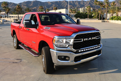 2021 red Ram 2500 HD with LEd light bar on top of bumper for off roading 