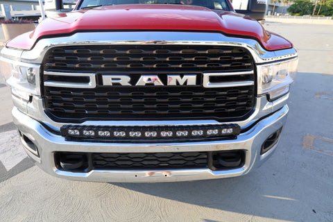 top view of 2024 red Ram 2500 HD with LEd light bar on top of bumper for off roading 