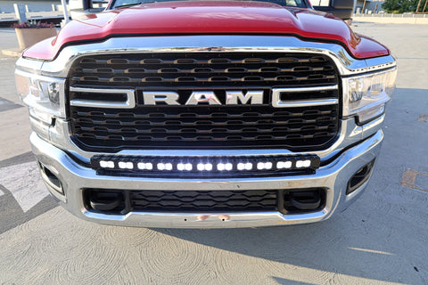 top view of 2024 red Ram 2500 HD with LEd light bar on top of bumper for off roading 