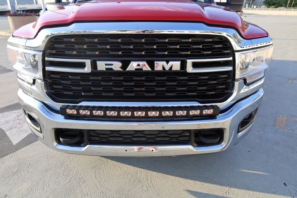 top view of 2025 red Ram 2500 HD with LEd light bar on top of bumper for off roading 