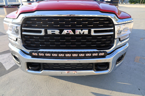 top view of 2025 red Ram 2500 HD with LEd light bar on top of bumper for off roading 