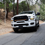 2025+ RAM 2500 light bar PRO 40in curved LED grille mount on white RAM 2500 driving on forest road
