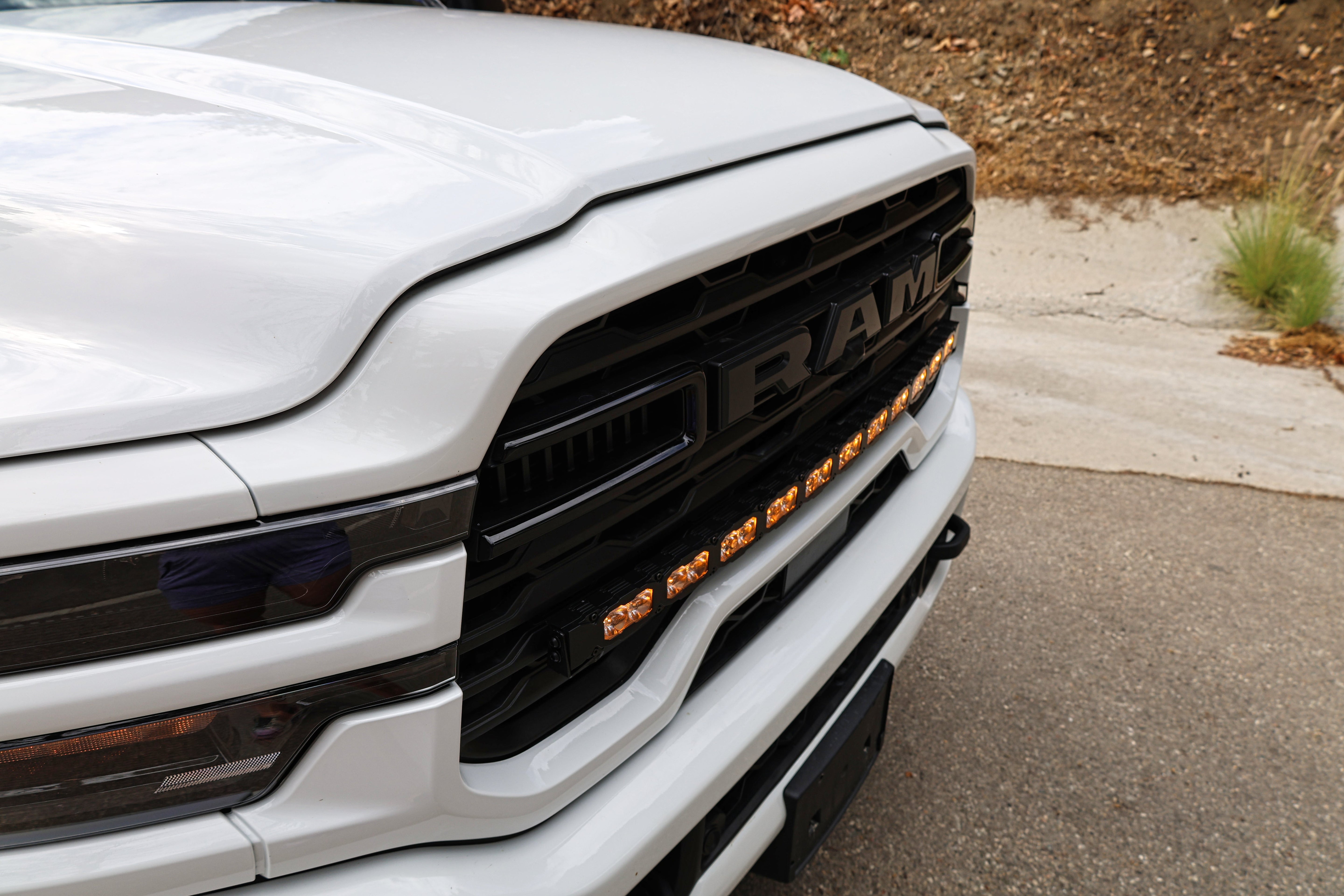 2025+ RAM 2500 light bar PRO curved 40in LED integrated in front grille on white RAM 2500 truck