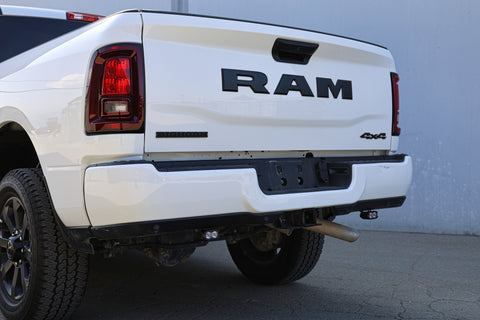 White Ram truck showing the rear with visible branding and reverse light kit