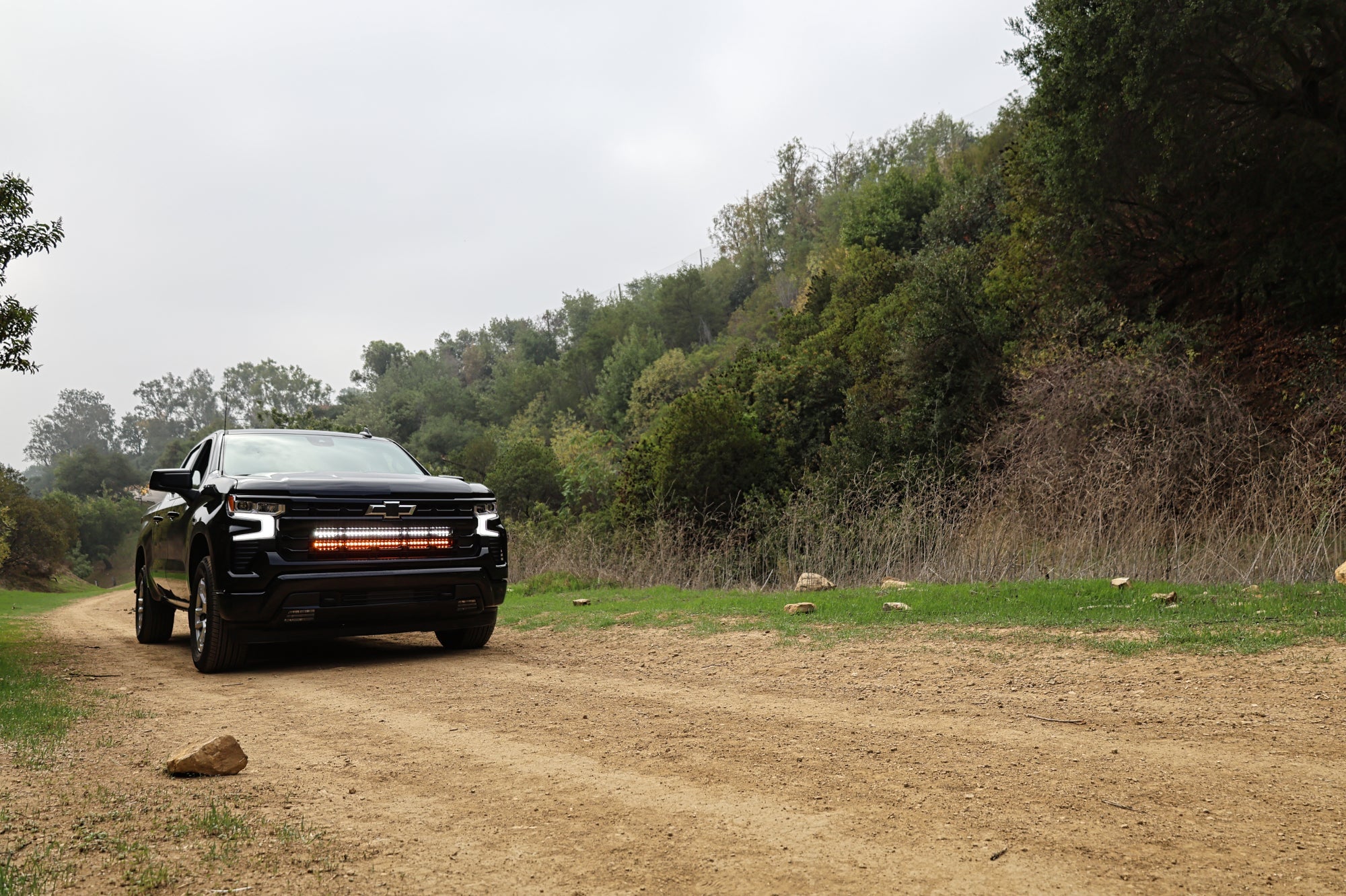 Black Chevrolet Silverado 1500 dual 40in LED light bars behind the front grille