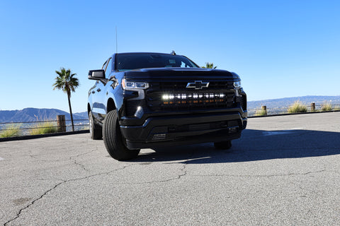 black chevrolet silverado 1500 with led off road light bars behind the grille