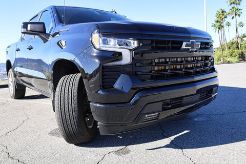 2023 black chevrolet silverado 1500 with led off road light bars behind the grille