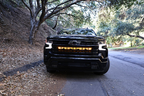 2022 black chevrolet silverado 1500 with led off road light bars behind the grille