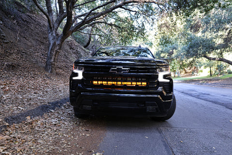2025 black chevrolet silverado 1500 with led off road light bars behind the grille